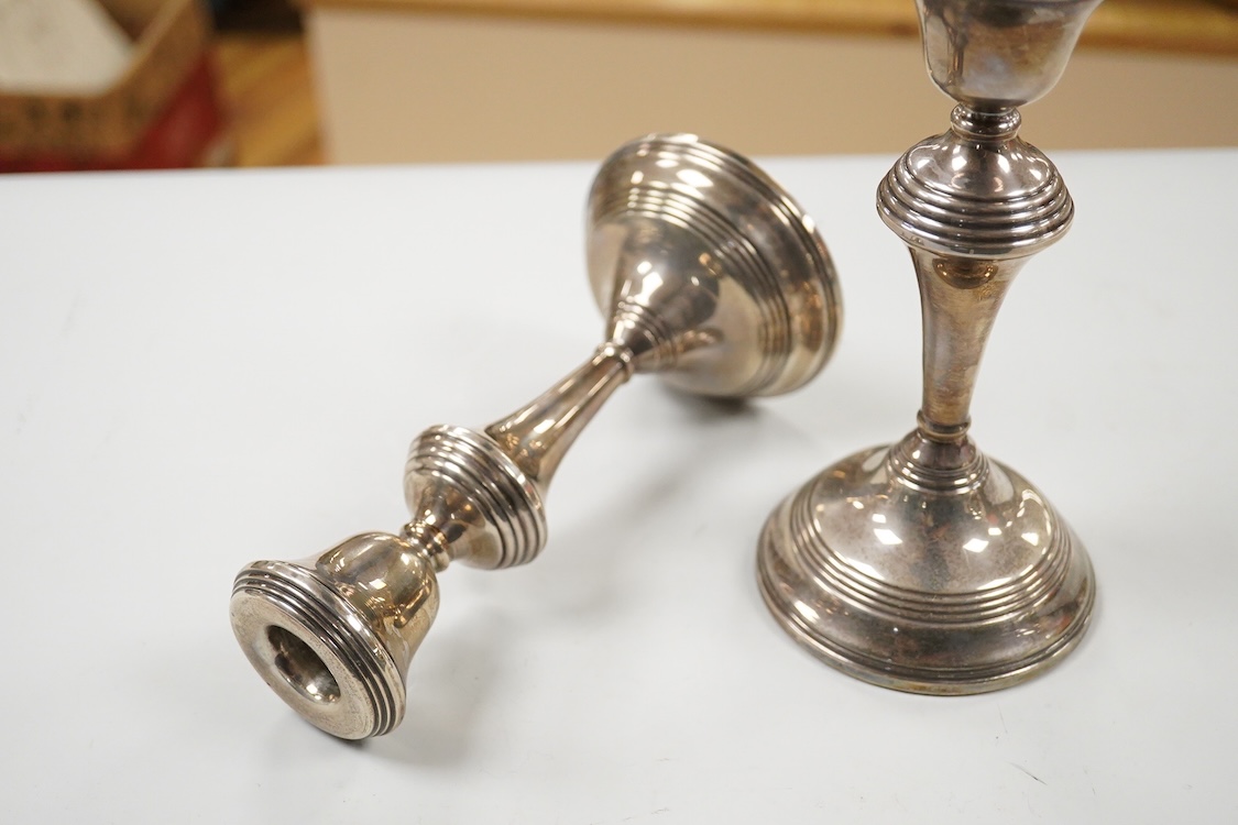 A pair of Elizabeth II silver mounted candlesticks, W.I. Broadway & Co, Birmingham, 1972, weighted, 17.7cm.